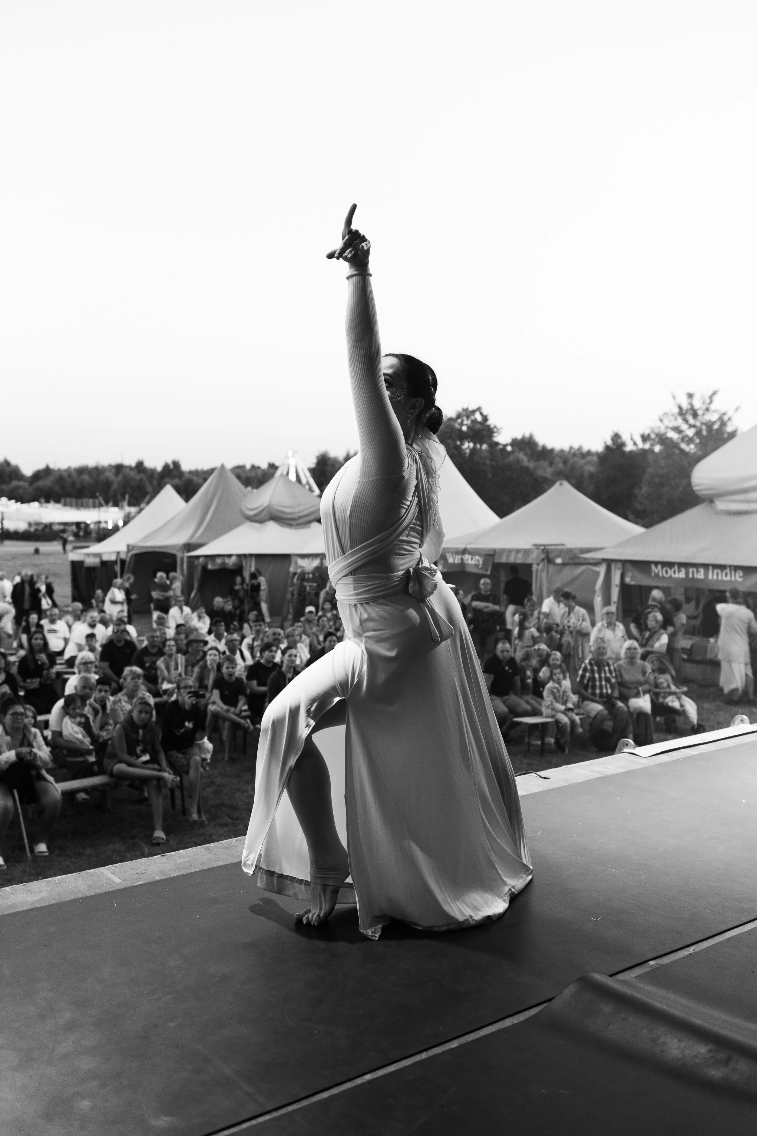 A dancer in motion under stage light